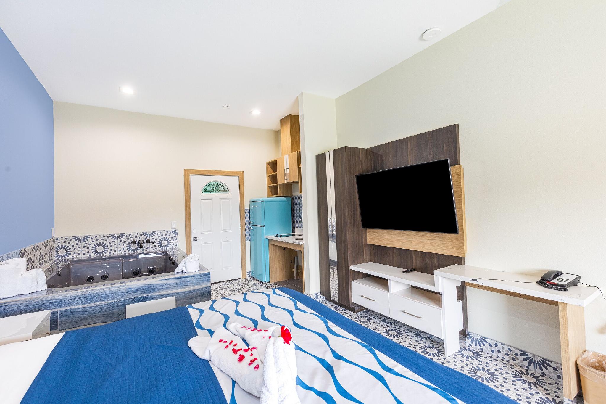 客房， 1 张特大床， 按摩浴缸