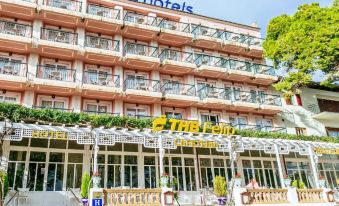 "a large hotel building with a sign that reads "" the real "" on the front of the building" at THB Felip - Adults Only
