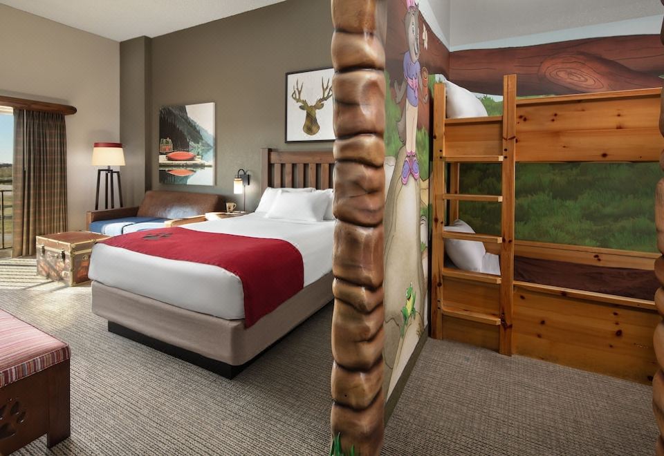 a hotel room with a large bed , a bunk bed , and a bathroom visible through a glass door at Great Wolf Lodge Grapevine