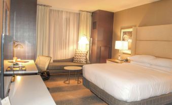 a hotel room with two beds , one on the left and one on the right side of the room at DoubleTree by Hilton Reading