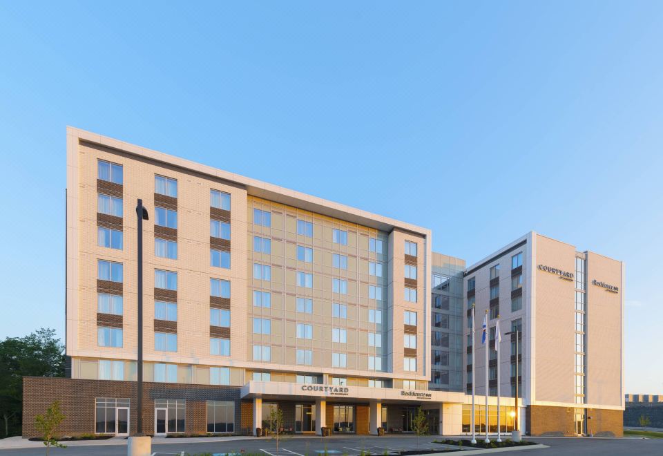 a large , modern hotel building with multiple floors and balconies , located in a city setting at Residence Inn Halifax Dartmouth