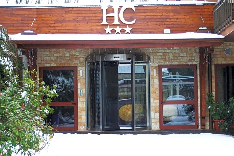 "a brick building with a sign that reads "" hc hotel "" prominently displayed on the front of the building" at Hotel Centrale