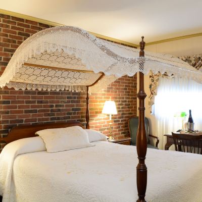 Deluxe Room, 1 Queen Canopy Bed Lamie's Inn and The Old Salt Restaurant Promo Code