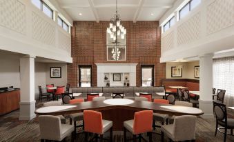 a large dining room with multiple tables and chairs arranged for a group of people to enjoy a meal together at Homewood Suites by Hilton Newtown - Langhorne