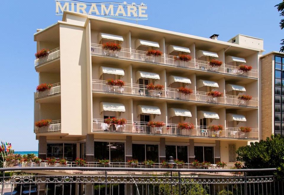 "a large hotel building with multiple balconies and a sign that reads "" miramare "" on it" at Hotel Miramare