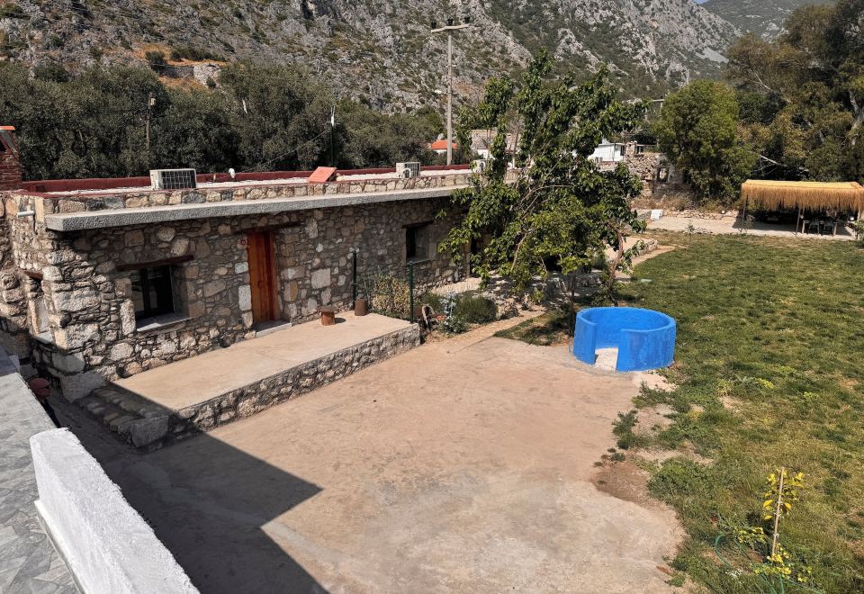 Hotel Anemos Stone Houses, Exterior, Garden