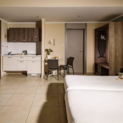 Family Room 115 the Strand Hotel & Suites by Neu Collective Promo Code