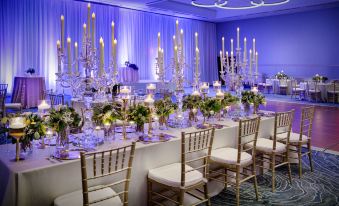 a large dining table set up for a formal event , with multiple chairs arranged around it at Hyatt Regency Dulles