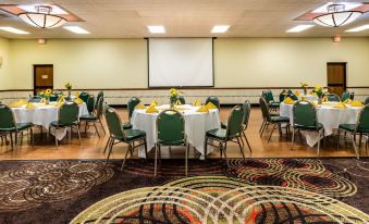 a conference room set up for a meeting , with tables and chairs arranged in a circle at Best Western Wichita North