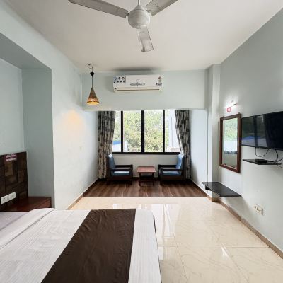 Deluxe Room with Air Conditioner Hotel Lions Den Promo Code