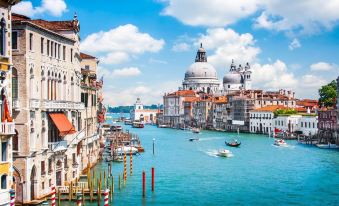 a beautiful view of the grand canal in venice , italy , with its buildings and boats visible at Hotel Nazionale