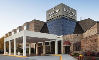 "a large brick building with a sign that reads "" doubletree by hilton "" prominently displayed on the front of the building" at DoubleTree by Hilton Hotel Oak Ridge-Knoxville