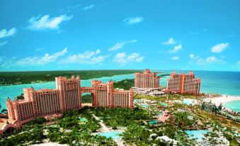 a bird 's eye view of a resort with tall buildings and a body of water at The Royal at Atlantis
