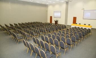 a large conference room with rows of chairs arranged in a semicircle , ready for a meeting at Royal Decameron Punta SAL - All Inclusive