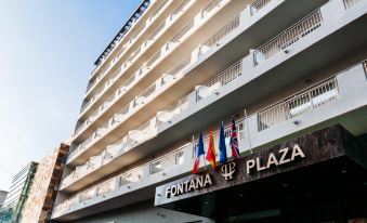 "a tall building with a sign that reads "" fontana plaza "" on the side of the building" at Hotel Fontana Plaza