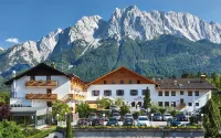 Romantik Alpenhotel Waxenstein Отели в г. 