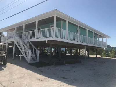 NEW RENTAL!!! Conch Heaven is a four bedroom house on a canal with a dock. Hotel a 