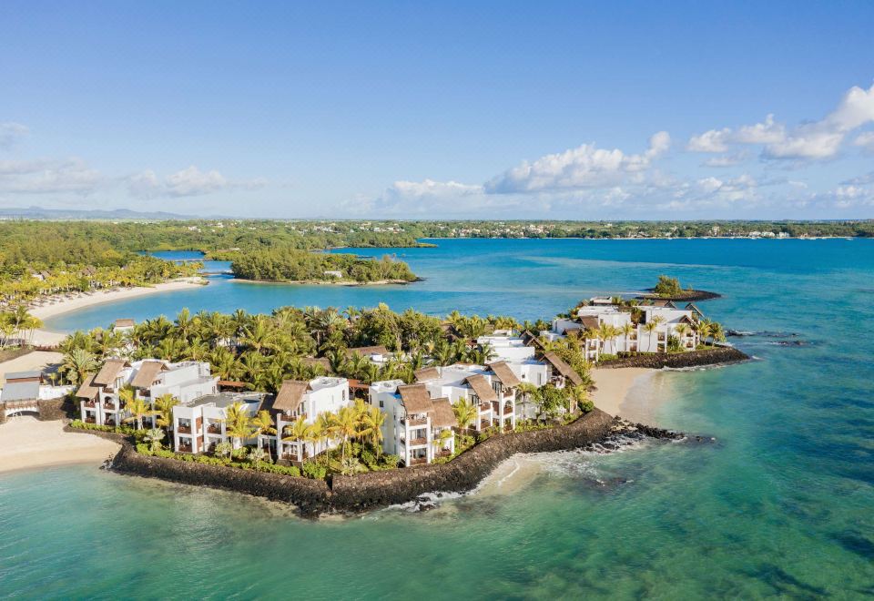 aerial view of a tropical island with multiple houses on a small island , surrounded by water at Shangri-La le Touessrok, Mauritius