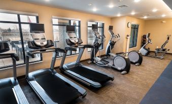 a well - equipped gym with various exercise equipment , such as treadmills , elliptical machines , and stationary bikes at Residence Inn Upper Marlboro Joint Base Andrews