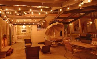 a room with multiple couches and chairs , some of which are under the ceiling lights at Villa Del Sol