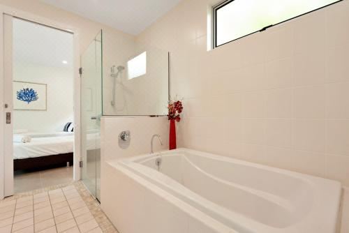 Pavillion 3 Absolute Waterfront 4 Bedroom 2 Lounge Room and Golf BuggyFour-Bedroom Apartment