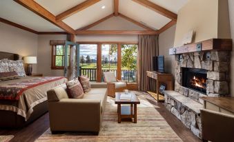 a living room with a couch , coffee table , and sliding glass doors leading to an outdoor patio at Sunriver Resort