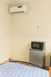 Cozy Guest Room in Kinshasa with Balcony and Partial Air-Conditioning  호텔