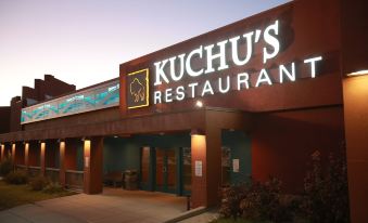 "a restaurant with a large sign that reads "" kuchu 's restaurant "" prominently displayed on the front of the building" at Ute Mountain Casino Hotel
