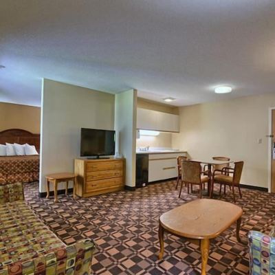 King Bed With Two Sofa Beds And Kitchenette Cabot Inn & Suites Promo Code