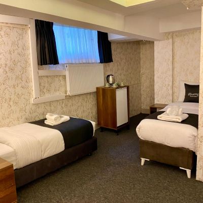 Economy Quadruple Room Honey Hotel Promo Code