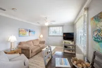 Salty Kisses Seaside Condo just steps to the beach and fishing pier