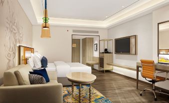a hotel room with a bed , desk , and tv , along with a comfortable seating area at Ekante Bliss Tirupati - Ihcl SeleQtions