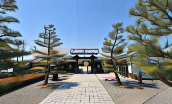 "a large building with a sign that reads "" china blue thunder "" is surrounded by trees and a walkway" at Hamamatsu Hotel