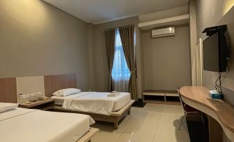 Triton Hotel Manokwari - Housity