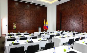 a large conference room with multiple tables and chairs arranged for a meeting or event at THB Felip - Adults Only