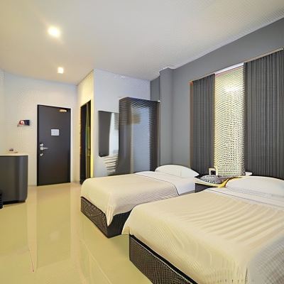 Deluxe Twin Room Studio Inn & Suites Promo Code