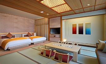 a modern , minimalist bedroom with wooden walls and ceiling , white beds , and a tv , as well as a living room area with comfortable seating at Hotel Metropolitan Yamagata