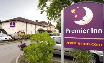 "a large purple sign with the word "" premiere "" on it is displayed in front of a building" at Premier Inn Bagshot