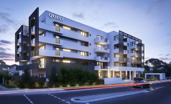 "a modern , white apartment building with the word "" quest "" prominently displayed on the side of the building" at Quest Cannon Hill