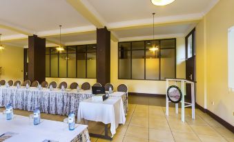 a large conference room with multiple rows of chairs arranged in a semicircle , ready for a meeting at Rainbow Ruiru Resort