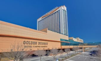 "a large hotel building with a sign that reads "" golden nugget hotel & casino "" in front of it" at Golden Nugget
