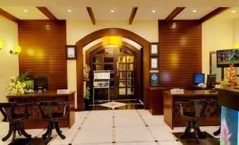 a hotel lobby with two desks and a reception area , creating a welcoming atmosphere for guests at The Richmond
