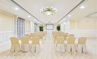There is a large room in the ballroom set up with tables and chairs for an event at Harbourview Hotel