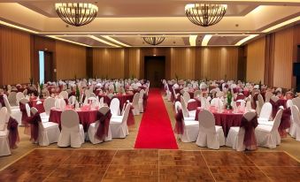 a large banquet hall with multiple tables covered in white tablecloths and chairs arranged for a formal event at Timberland Highlands Resort