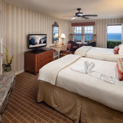 Ocean Front Two Queen Room with Patio Cottage Inn by The Sea Promo Code