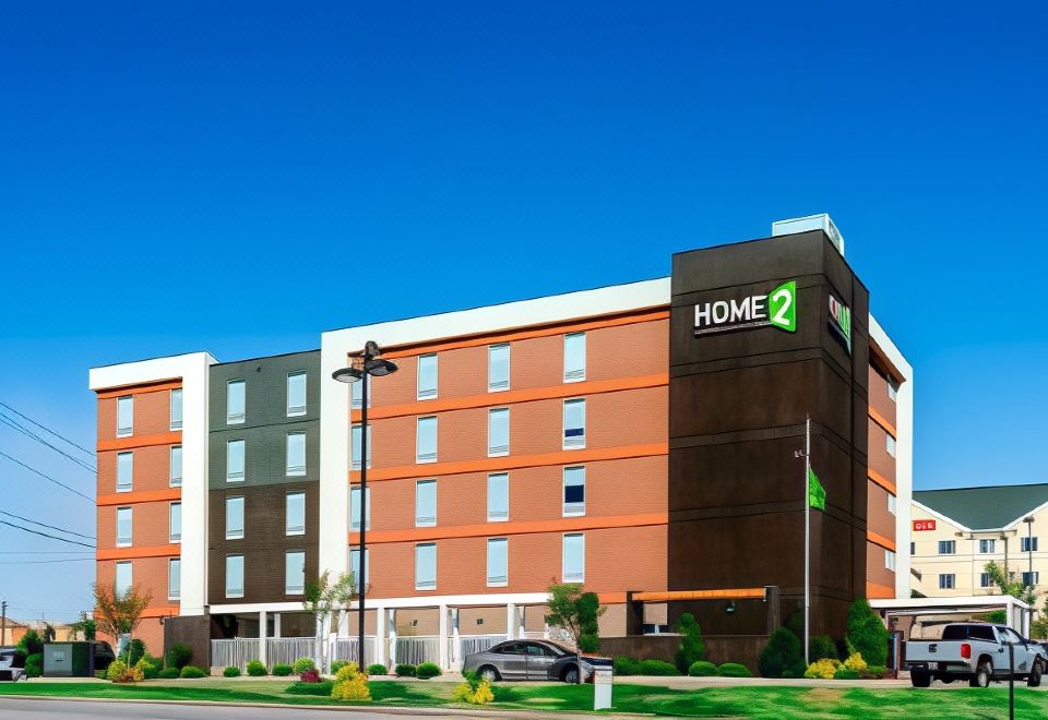 "a large hotel building with the word "" home 2 "" on it , located in a residential area" at Home2 Suites by Hilton Oxford