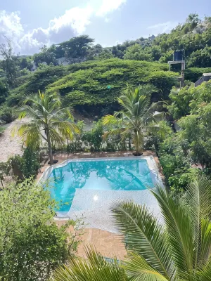 Dive in to our pool and feel the breeze at Mbibo House in the Shela sand dunes Hotels in 