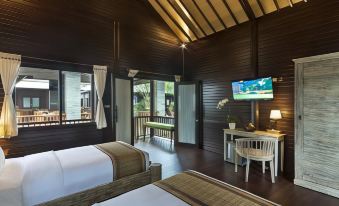 a modern , wooden interior with a balcony offering a view of the outdoors and an outdoor kitchen area at Coconut Boutique Resort