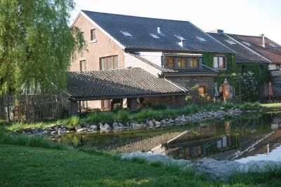Part of an old manor with a large swimming pond at the border triangle B, NL, D Hotels in 