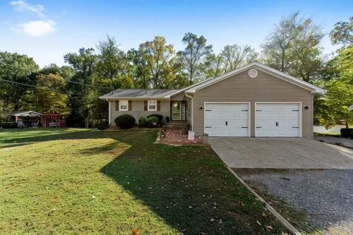 3 bedroom/2 full bath lakefront home with gentle slope to private covered dock